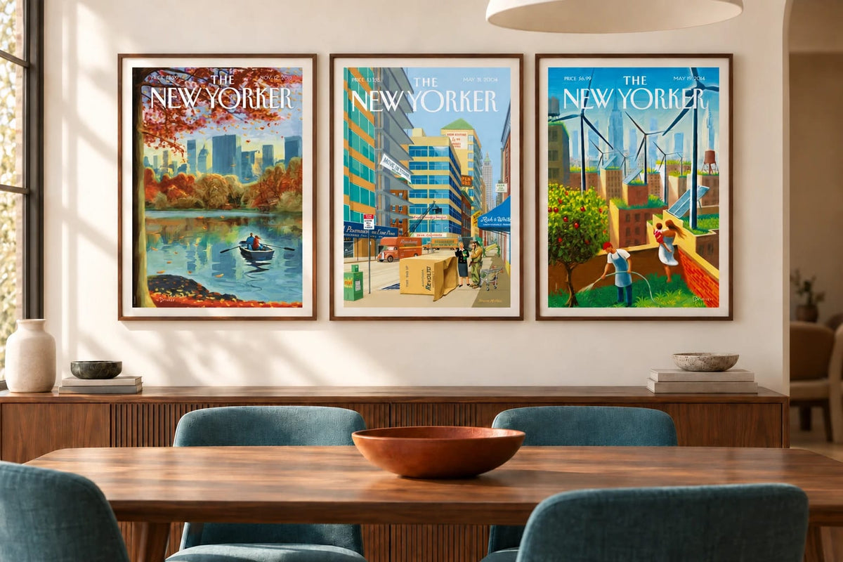Autumn trees, a city street, and green rooftops hang above a wood sideboard in a light dining room.