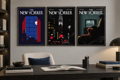 Three dark city prints hang above a desk in a bright office.