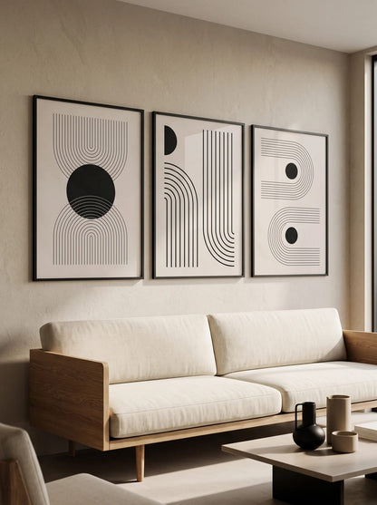 Three black-and-white geometric prints grouped in a room view; frames are not included.