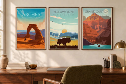A rock arch, bison, and canyon scene hang above a desk in a light office.