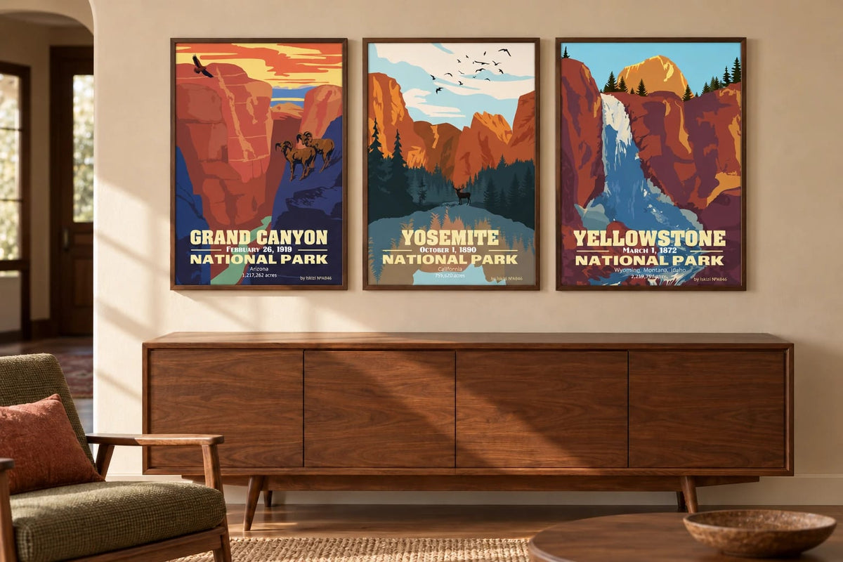 Three park prints above a walnut console beside an olive chair on a sand-colored wall.