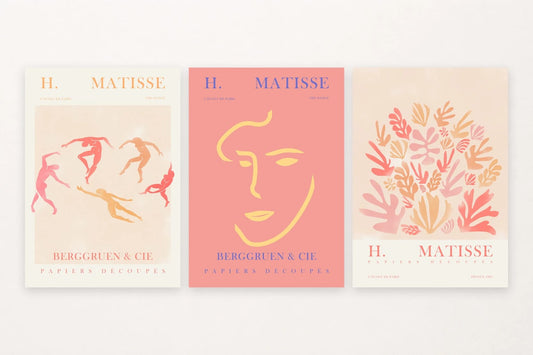 Three abstract prints: dancers, a yellow face, and warm leaves.
