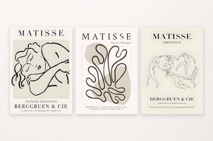 Three prints with a resting figure, winding contour, and dancing figures with visible printed words.