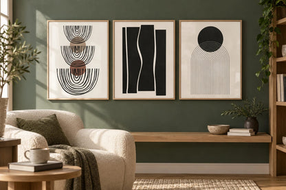 Abstract arch and circle prints grouped on a bedroom wall.