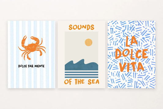 Three coastal prints with a striped crab, turquoise waves, and summer lettering.