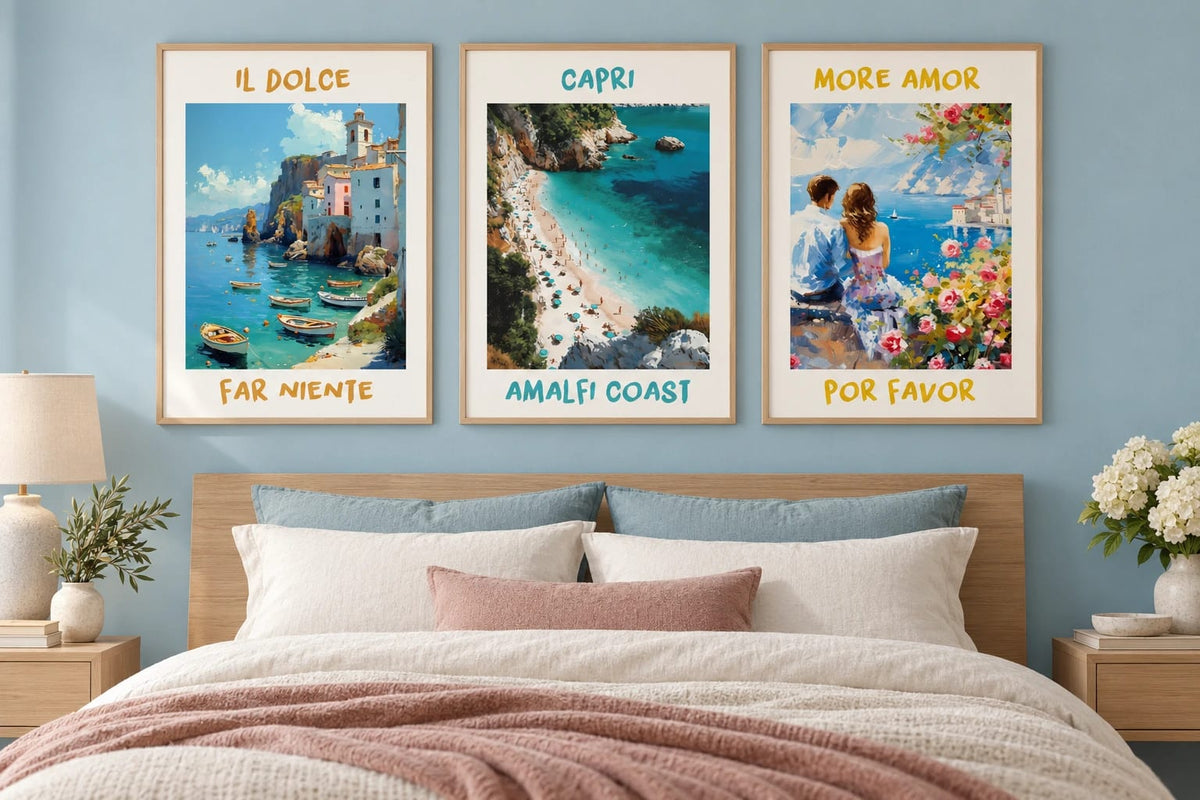 Three coastal prints above a bed in a blue bedroom.