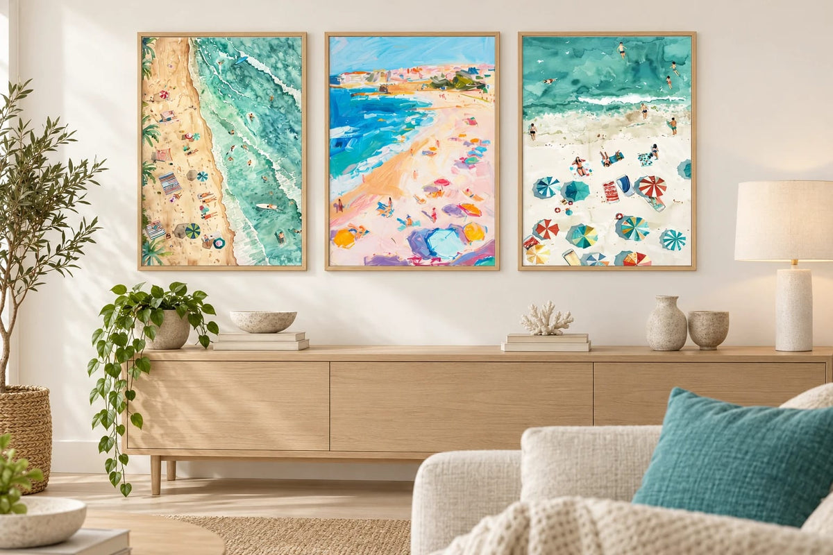 Beach prints above an oak dresser in a light living room.
