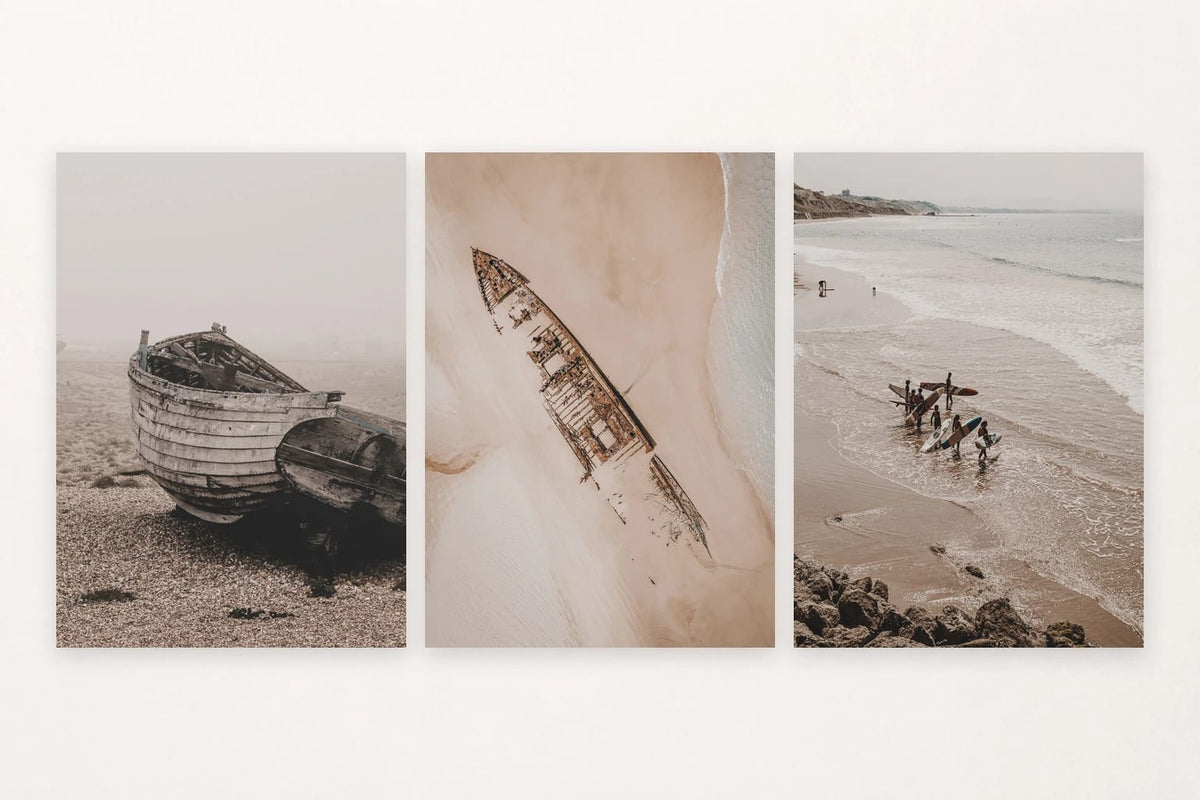Three muted shore scenes with wooden boats, a shipwreck, and surfers.