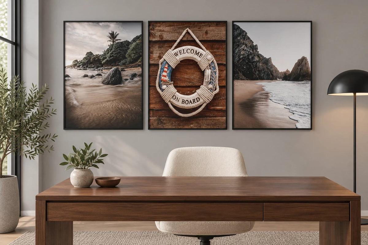 Three shore prints above a desk in a gray office.