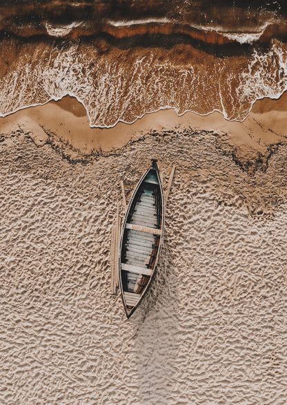 long wooden boat viewed from above beside foam.
