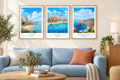 Coastal cityscape prints above a blue sofa.