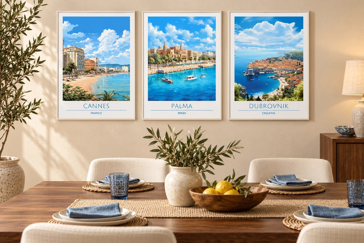 Three Mediterranean harbor prints in a light dining room.