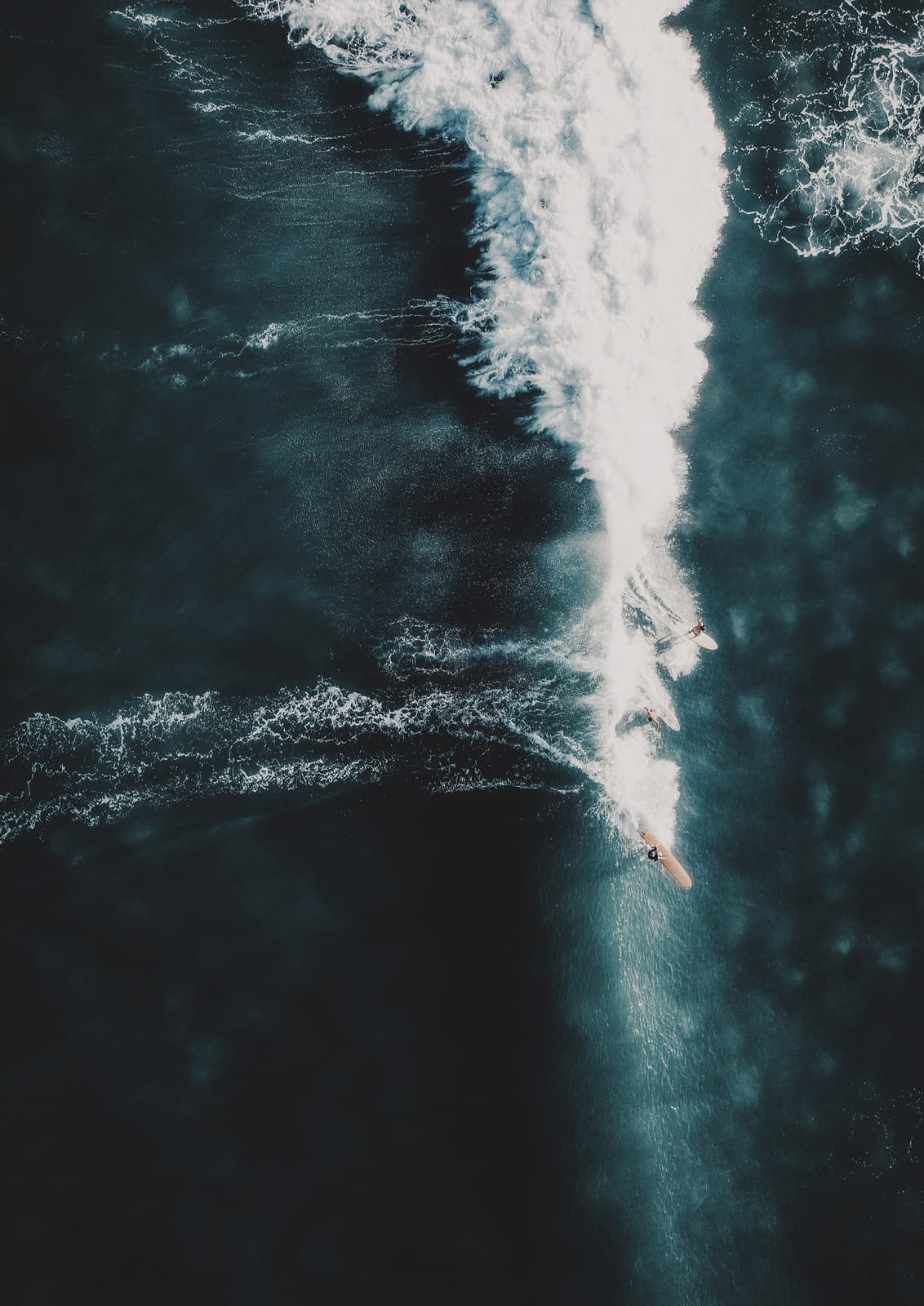 surfer on a diagonal breaking wave.