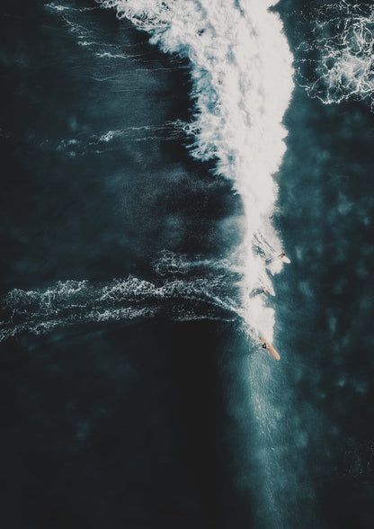 surfer on a diagonal breaking wave.