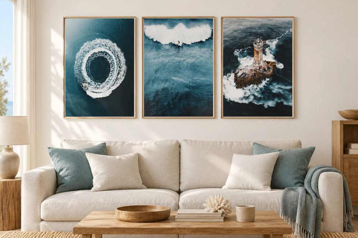 Coastal triptych in a light living room.
