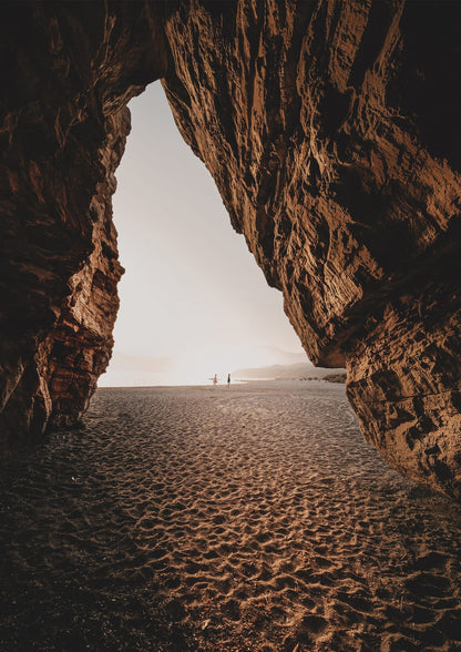 shore viewed through a stone arch.