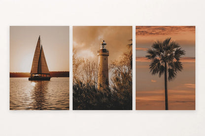 Warm sunset set with a sailboat, lighthouse, and palm silhouette.