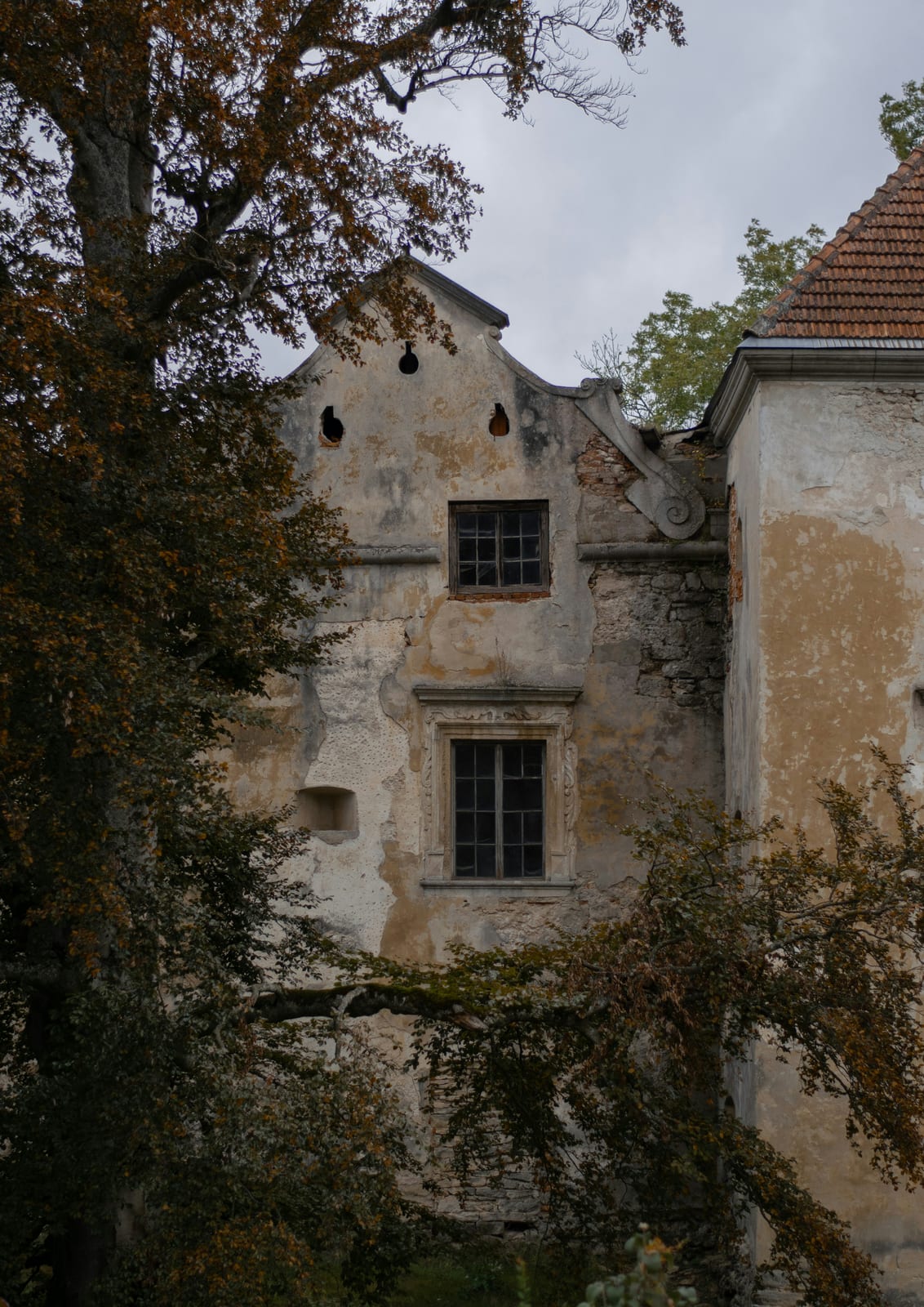old facade framed by autumn surroundings.
