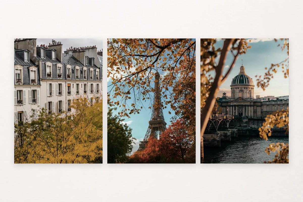 Autumn city prints with slate roofs, a tower, and a domed building by a river.
