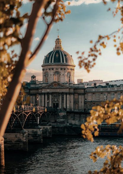 domed stone building beside a river and bridge.