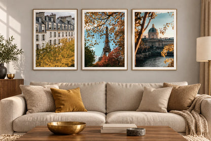 Autumn city prints above a light sofa.