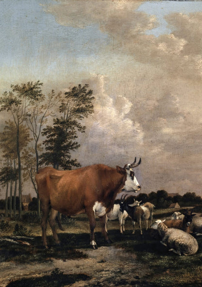 A cow and sheep gather near trees.