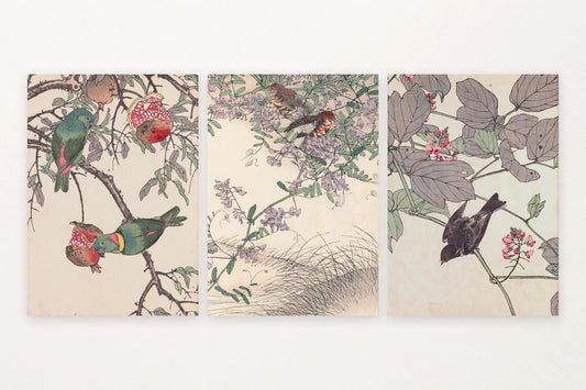 Three bird prints pair green parrots, flowering branches, and a dark bird among pink blossoms.