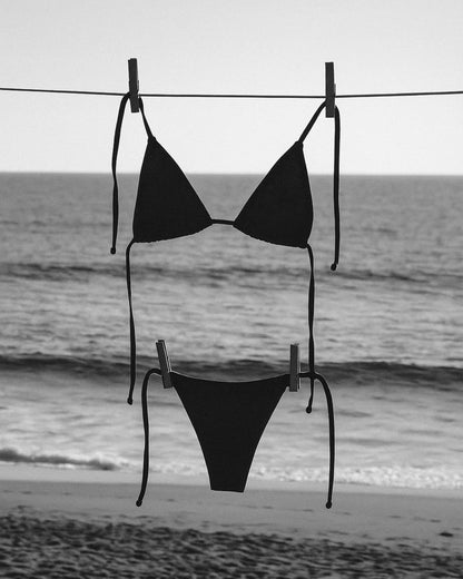 A swimsuit hanging near the shore.