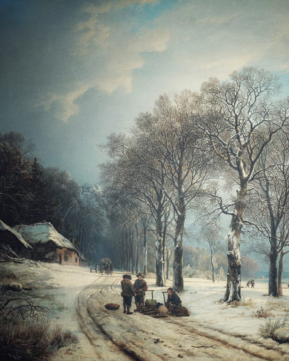 A winter road passing trees near a village.