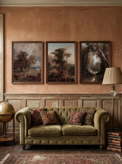 Three landscapes above a green sofa on a terracotta wall.