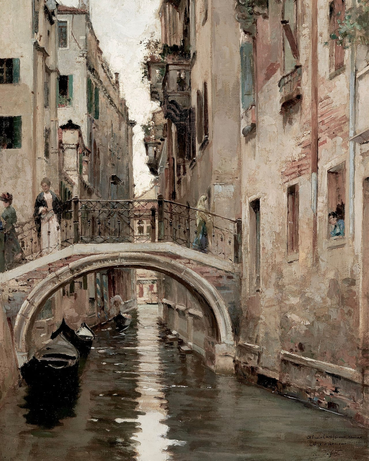 Boats beside an arched bridge over a canal.