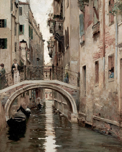 Boats beside an arched bridge over a canal.