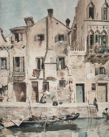 Light homes and boats beside a canal.