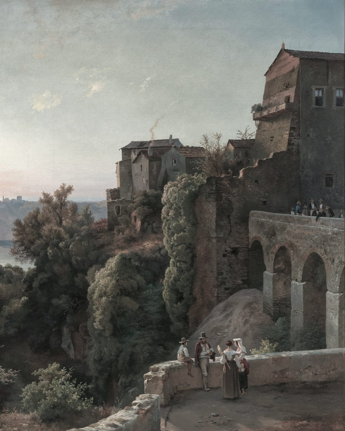 A stone castle and bridge above a valley.