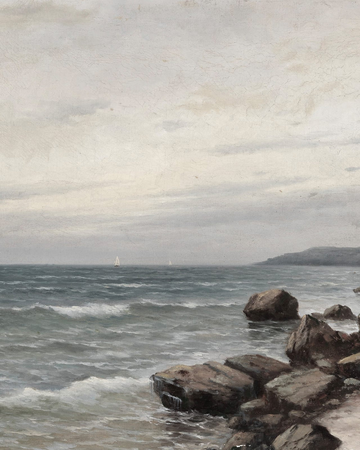 A rocky shoreline beneath an overcast sky.