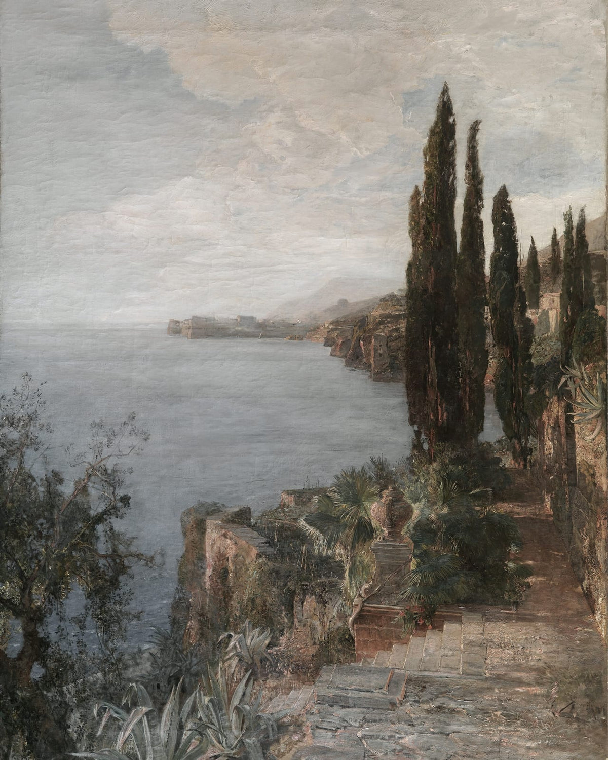 Cypress trees and garden steps beside the coast.
