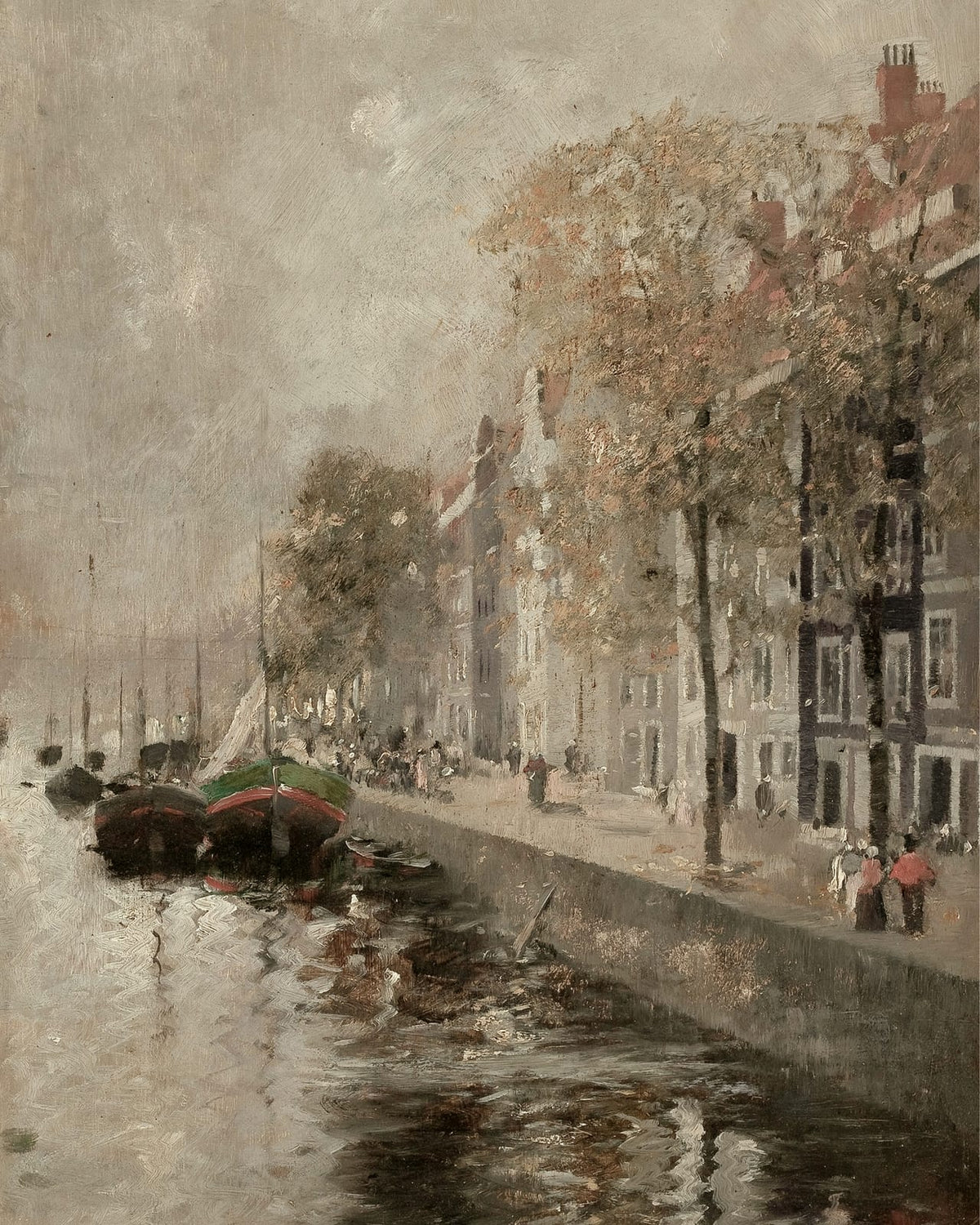 Boats moored along a canal-side street.