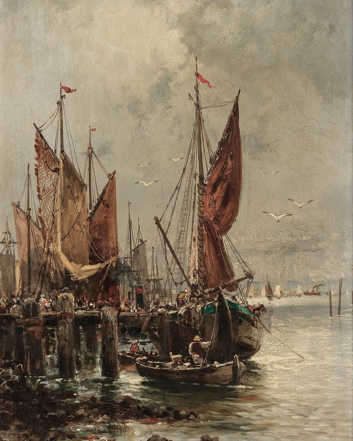 Tall sails above boats in a harbor.