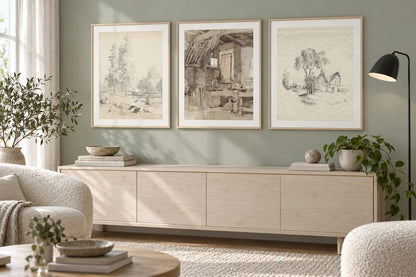 A sketch print set displayed on a gray-green wall.