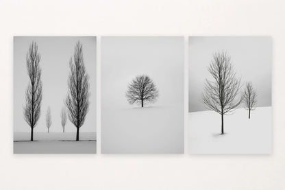Three snowy landscapes show four trees in a field, one tree alone, and two trees on a slope.