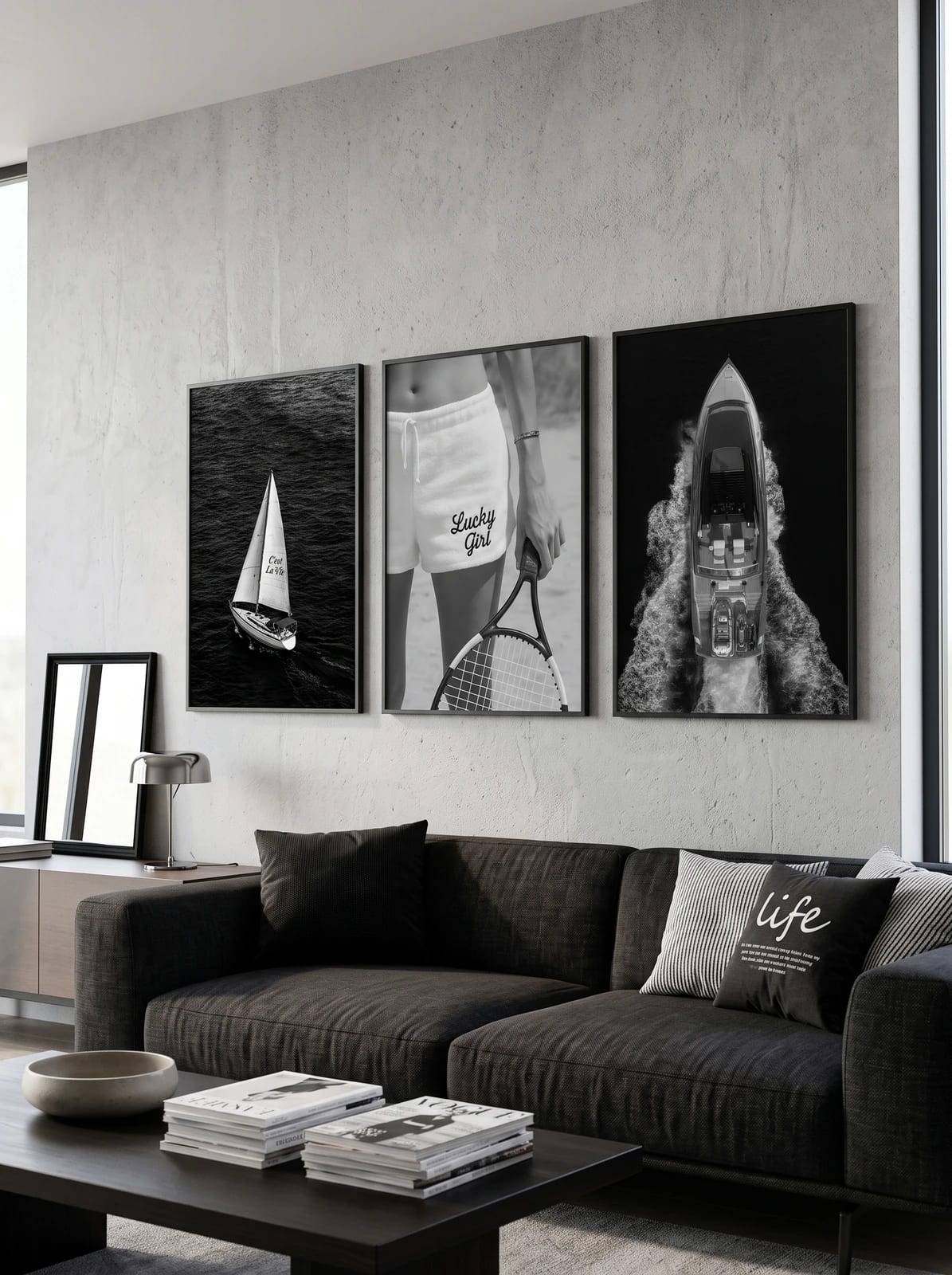 A sailboat, tennis racket with printed shorts, and motorboat wake displayed together in a room; frames are not included.
