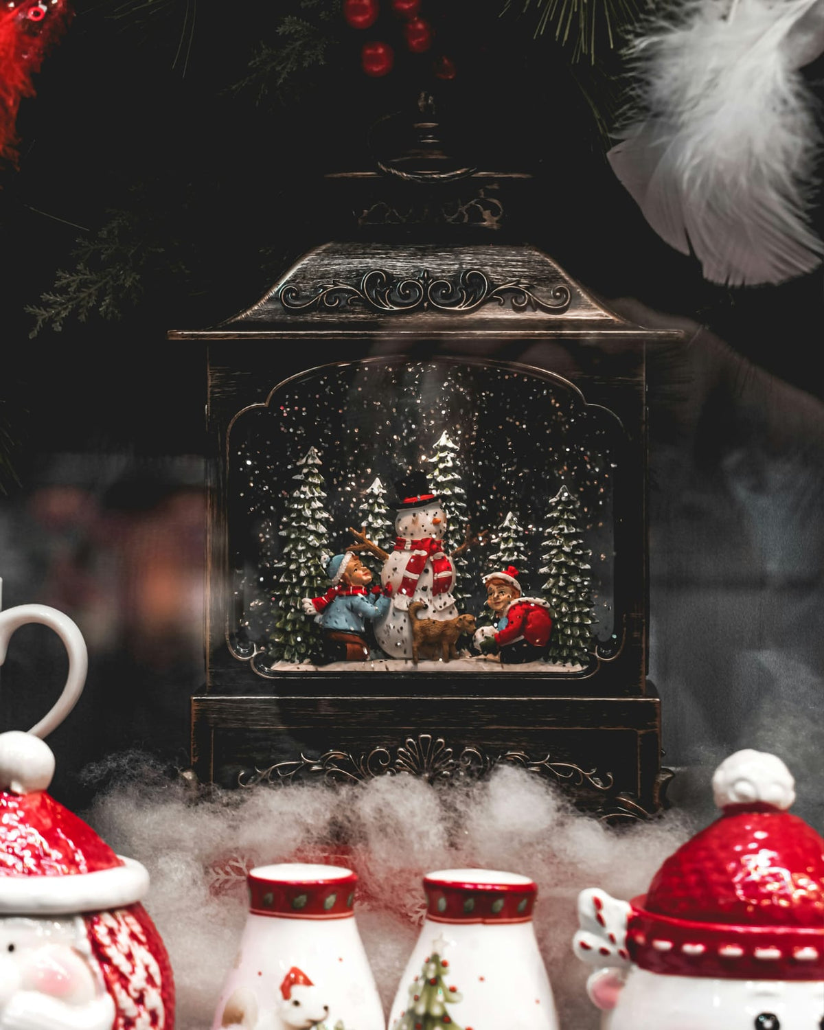 A snow globe containing a winter scene.