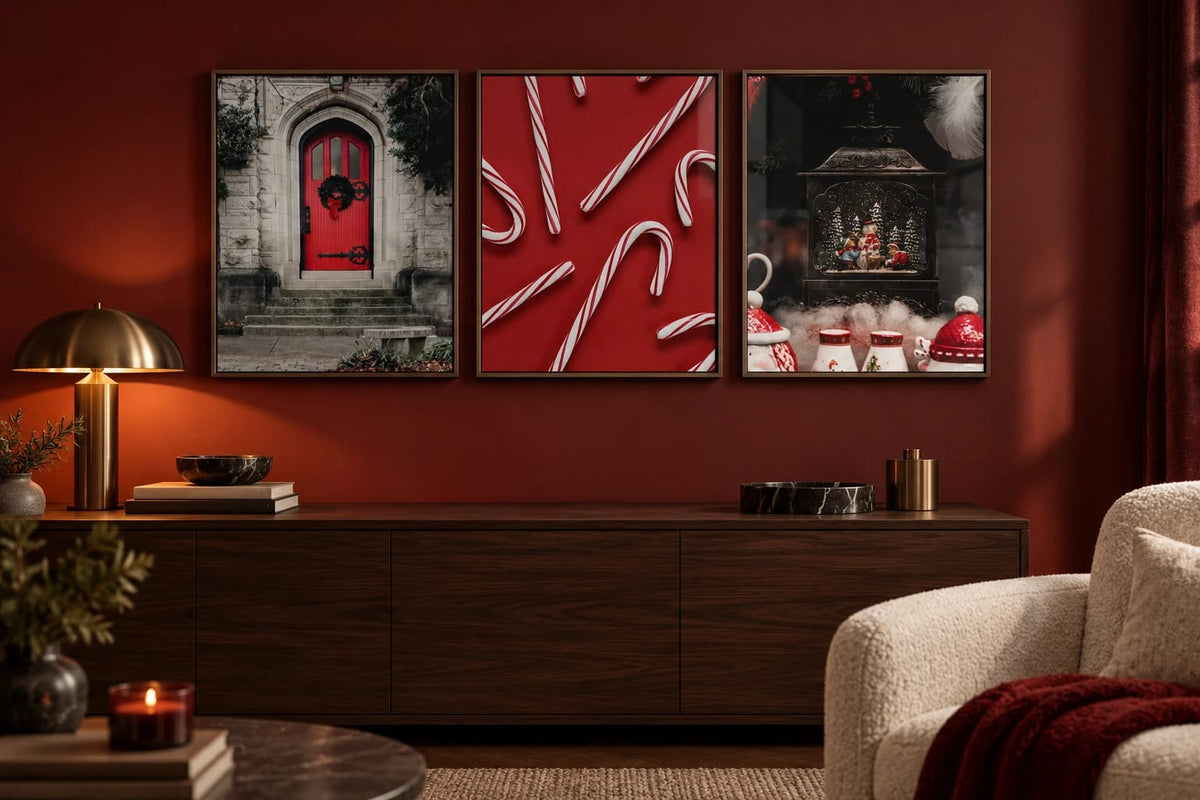 A red door and snow globe print set on a deep red wall.
