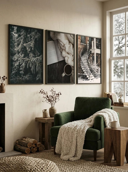 Three winter drawings above a green chair with a blanket.