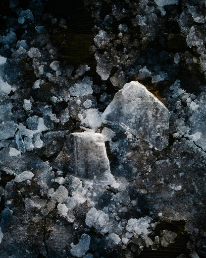 Ice floes against a dark background.