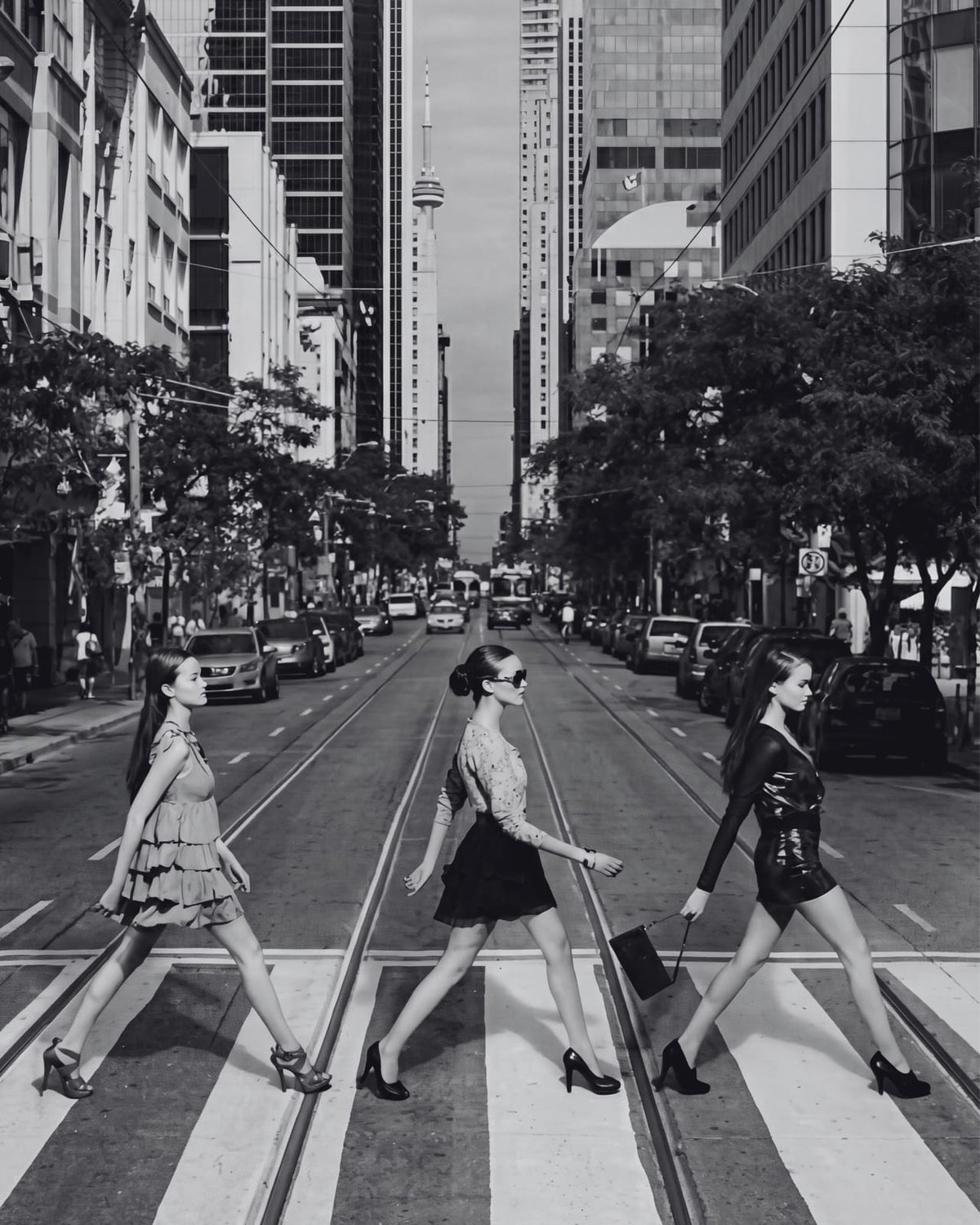 Three women crossing a city street.
