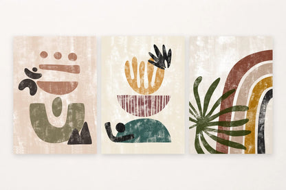 Three prints show an abstract face, a striped plant form, and olive leaves over arches.