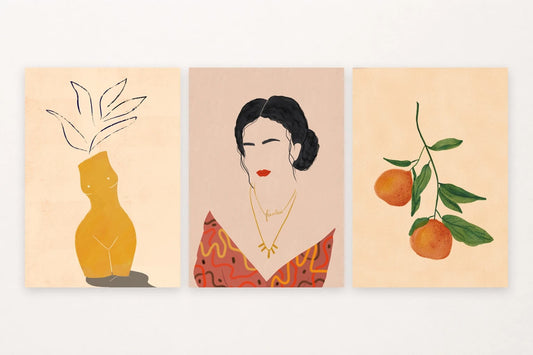Three prints show an ochre vase, a woman's portrait, and oranges on a green branch.