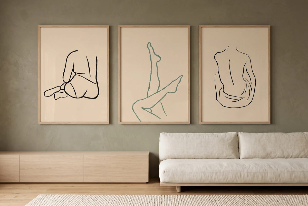Three figure line drawings displayed on an olive living-room wall.
