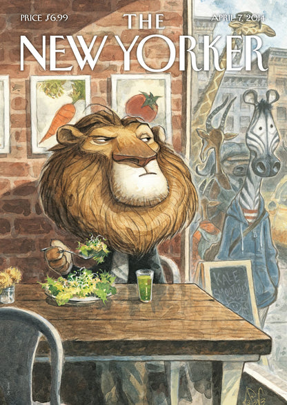 A lion sits at a table among food and framed pictures on a magazine cover.